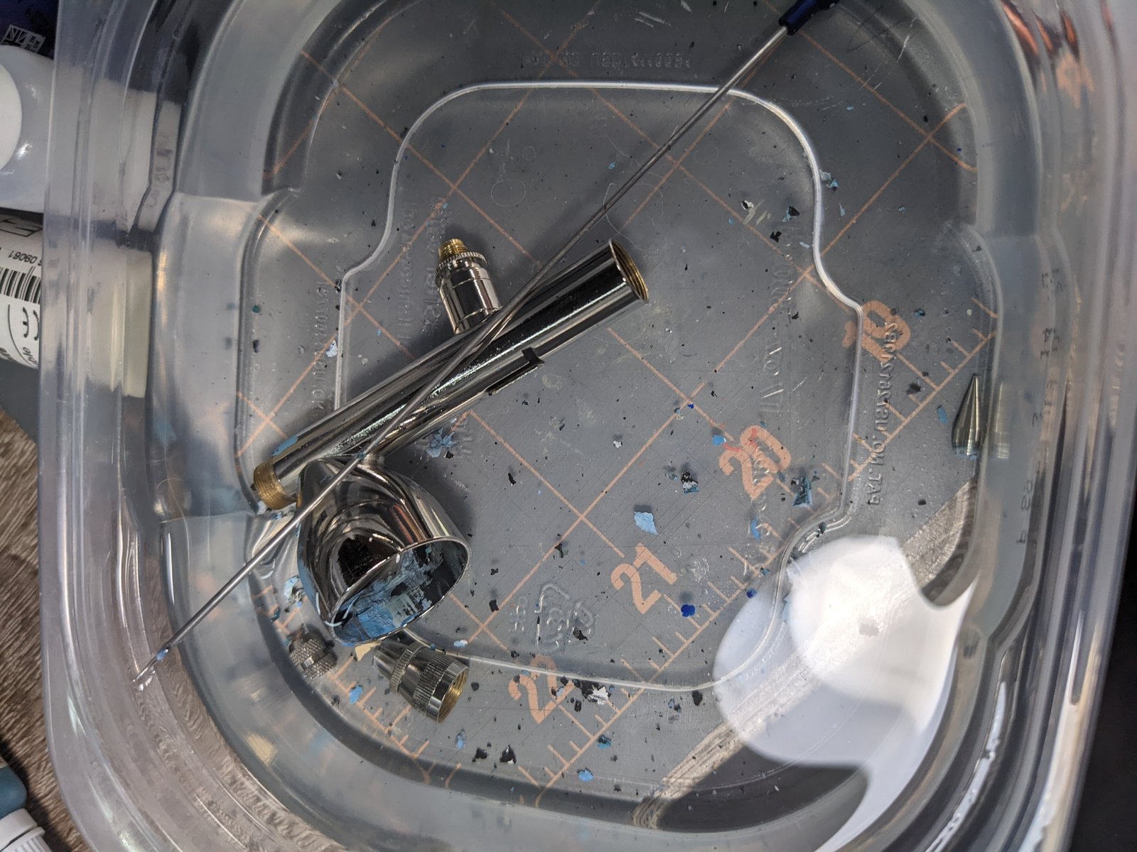 Airbrush cleaning in tub of isopropyl alcohol